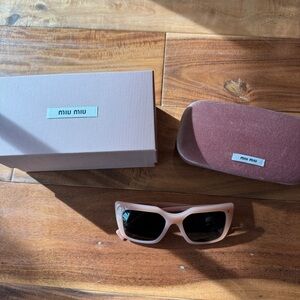Miu Miu Blush Sunglasses made in Italy 
Model number SMU 02W